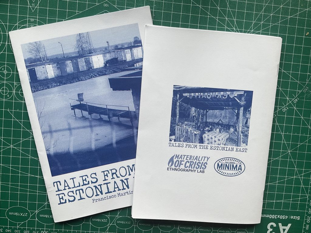 Two zines on a green cutting mat; one shows the cover “Tales from the Estonian East,” the other shows the back cover with a blue photo and logos.